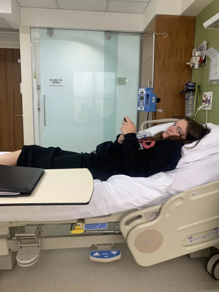 Taise Campbell lying on hospital bed